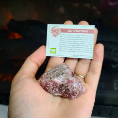 Raw Red Aventurine crystal with a description 
