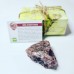 Raw Red Aventurine crystal with a description 