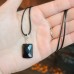 Faceted Black Agate rectangular shape stainless steel Zirconia clasp pendant with a black cord