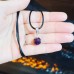 Faceted Amethyst Stainless steel Zirconia pendant with a black cord
