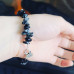 Snowflake Obsidian, Matte Hematite Lotus charm bracelet