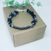 Snowflake Obsidian, Matte Hematite Lotus charm bracelet