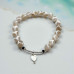 Pure Harmony Bracelet - 8 mm White Spotted Agate with Mother of Pearl heart charm Pure Harmony Bracelet - 8 mm White Spotted Agate with Mother of Pearl heart charm