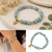 8 mm Jade Bracelet with Gold Stainless Steel Angel Charm