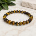 8 mm Tiger's Eye Bracelet with Gold Stainless Steel Spacer 8 mm Tiger's Eye Bracelet with Gold Stainless Steel Spacer