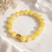 10 mm Yellow Calcite Bracelet with Gold Stainless Steel Heart Accent 10 mm Yellow Calcite Bracelet with Gold Stainless Steel Heart Accent