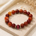 12 mm Carnelian Bracelet with Pink Cat Eye Accent Bead 12 mm Carnelian Bracelet with Pink Cat Eye Accent Bead