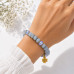 8 mm Jade Bracelet with Czech Crystals & Gold Stainless Steel Flower Charm 8 mm Jade Bracelet with Czech Crystals & Gold Stainless Steel Flower Charm