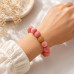 12 mm Strawberry Quartz Bracelet with Gold Stainless Steel Round Charm 12 mm Strawberry Quartz Bracelet with Gold Stainless Steel Round Charm