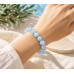 10 mm Faceted Aquamarine Bracelet with Gold Stainless Steel Spacer 10 mm Faceted Aquamarine Bracelet with Gold Stainless Steel Spacer