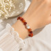 8 mm Carnelian Bracelet with Hand-Painted Porcelain Bead 8 mm Carnelian Bracelet with Hand-Painted Porcelain Bead