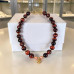 14 mm Red Tiger’s Eye Necklace with Gold Flower Charm — 16 inch 14 mm Red Tiger’s Eye Necklace with Gold Flower Charm — 16 inch