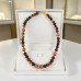 10 mm Tiger’s Eye and 12 mm Cat’s Eye Necklace with Zirconia Infinity Clasp - 20 inch 10 mm Tiger’s Eye and 12 mm Cat’s Eye Necklace with Zirconia Infinity Clasp - 20 inch