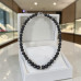 10 mm Lava Stone and 12 mm Dark Grey Cat’s Eye Necklace — 19 Inches 10 mm Lava Stone and 12 mm Dark Grey Cat’s Eye Necklace — 19 Inches