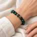 10 mm Green Tiger’s Eye Bracelet with Stainless Steel Petal Spacers 10 mm Green Tiger’s Eye Bracelet with Stainless Steel Petal Spacers