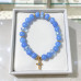 8 mm Aquamarine Bracelet with Czech Crystals and Gold Stainless Steel Cross 8 mm Aquamarine Bracelet with Czech Crystals and Gold Stainless Steel Cross