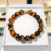 10 mm Tiger's Eye Bracelet with Stainless Steel Spacer Charm 10 mm Tiger's Eye Bracelet with Stainless Steel Spacer Charm