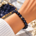 10 mm Faceted Blue Goldstone Bracelet with Silver-Tone Stainless Steel Spacer