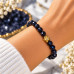 8 mm Faceted Blue Goldstone Bracelet with Gold Stainless Steel Charm