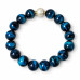 12 mm Blue Tiger’s Eye Bracelet with Faux Pearl and Gold-Tone Accents 12 mm Blue Tiger’s Eye Bracelet with Faux Pearl and Gold-Tone Accents