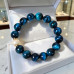 12 mm Blue Tiger’s Eye Bracelet with Faux Pearl and Gold-Tone Accents 12 mm Blue Tiger’s Eye Bracelet with Faux Pearl and Gold-Tone Accents