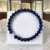 6 mm Dark Blue Tiger’s Eye Bracelet with Silver-Tone Stainless Steel Accent 6 mm Dark Blue Tiger’s Eye Bracelet with Silver-Tone Stainless Steel Accent