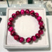 10 mm Pink Tiger’s Eye Bracelet with Silver-Tone Stainless Steel Spacer 10 mm Pink Tiger’s Eye Bracelet with Silver-Tone Stainless Steel Spacer