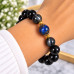 12 mm Black Obsidian Bracelet with Dark Grey Cat’s Eye and Murano-Style Crystal 12 mm Black Obsidian Bracelet with Dark Grey Cat’s Eye and Murano-Style Crystal