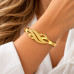 Gold Stainless Steel Infinity Twist Bangle – Textured and Polished Design Gold Stainless Steel Infinity Twist Bangle – Textured and Polished Design