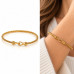 Gold Stainless Steel Twisted Bangle with Zirconia Hook Clasp
