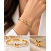 Gold Stainless Steel Bow Bangle with Zirconia – Elegant Ribbon Design Gold Stainless Steel Bow Bangle with Zirconia – Elegant Ribbon Design