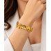 Gold Stainless Steel Leaf Bangle with Zirconia Accents Gold Stainless Steel Leaf Bangle with Zirconia Accents