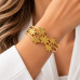 Gold Stainless Steel Floral Bangle – Textured Flower Design Gold Stainless Steel Floral Bangle – Textured Flower Design